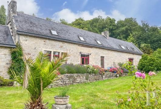 brittany - In southern Brittany, in a wooded valley near the ocean, within 1.5 ha A 420 m² rural estate with two dwellings and a multi purpose storage building